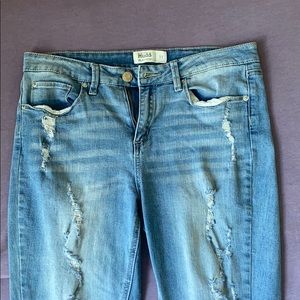 Distressed blue jeans